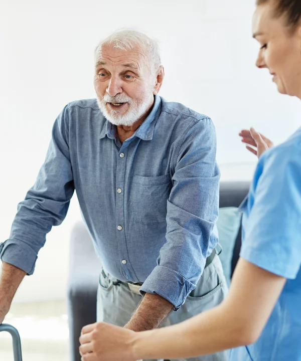 Nurse assisting old man