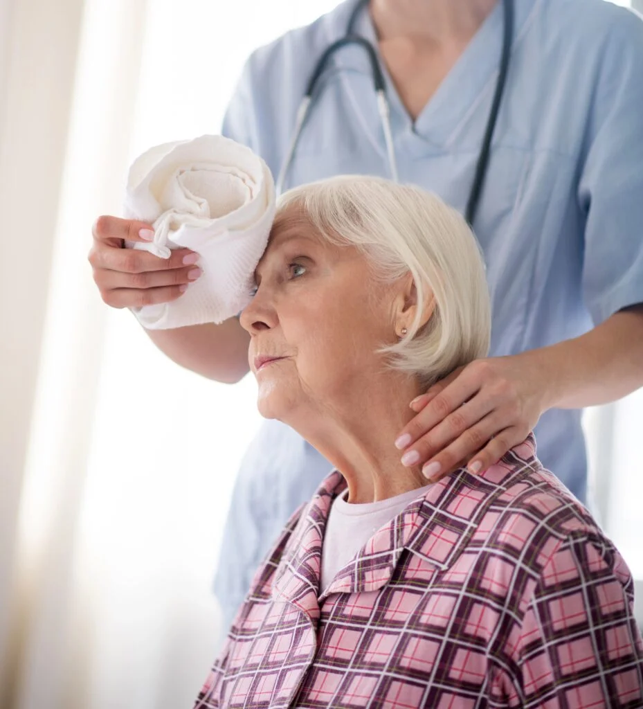 Having strong headache. Aged grey-haired lady having strong headache in the morning